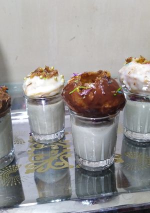 A picture of Golgappa dessert with paan shots.