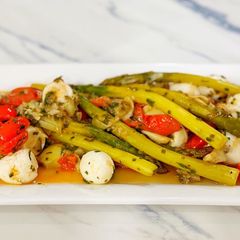 A picture of Asparagus, tomato & artichoke salad.