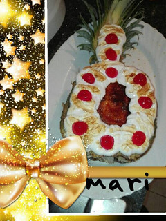 Una foto de Piña rellena de crema de vainillla y merengue