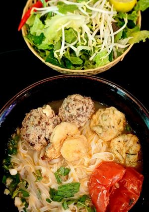 A picture of Banh Da Noodle Soup with Shrimp, Pork, and Fish Cake.