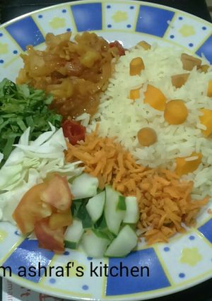 A picture of Rice with carrot and sauce.