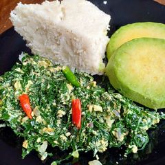 A picture of Kales fried with eggs.