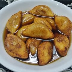 A picture of Aloo Suji Pitha or Potato Semolina Sweet Dumplings.