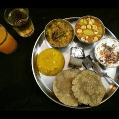 LUNCH-THALI Aloo Makhana,Namken kaddu,Jeera RaitaHalwa,JowarPuri A picture of LUNCH-THALI Aloo Makhana,Namken kaddu,Jeera RaitaHalwa,JowarPuri.