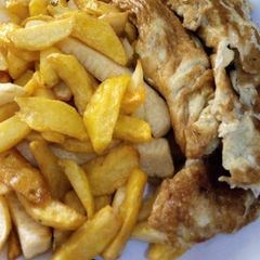 A picture of Fried chips and egg.