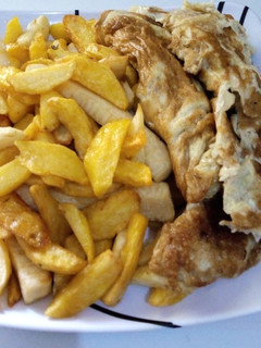 A picture of Fried chips and egg.