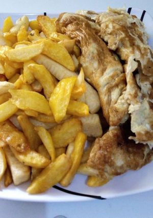 A picture of Fried chips and egg.