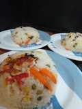 Arroz sobrante al estilo paella con pollo y verduras