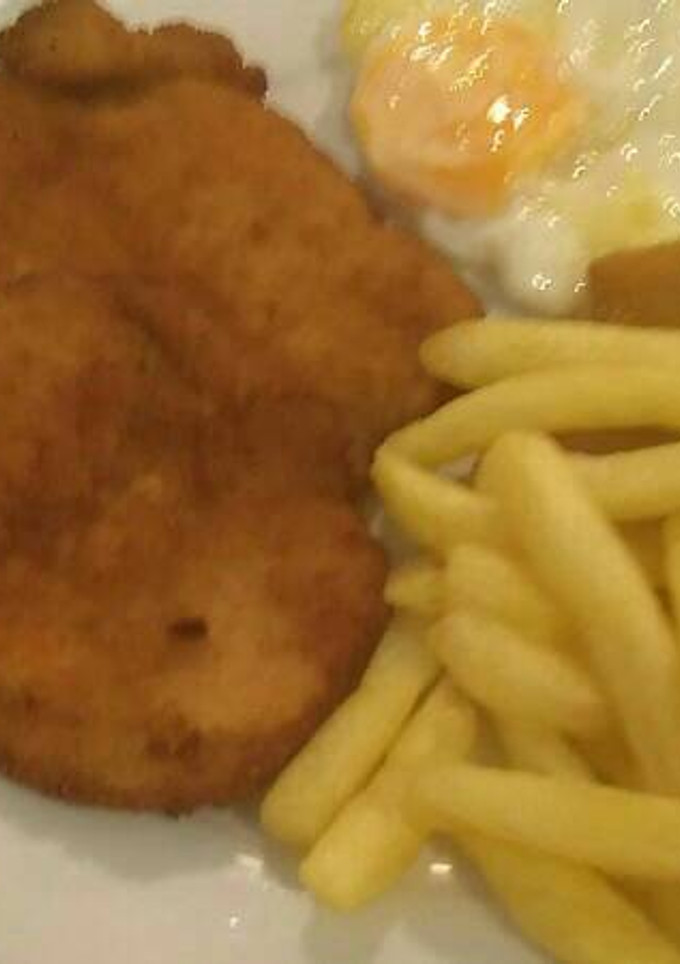 Una foto de 434 Pechuga rebozada en patatas fritas de bolsa