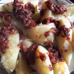 A picture of Sweet potatoes and sauce.