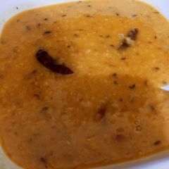 A picture of Daal tadka (yellow split lentil).