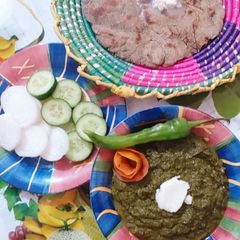 A picture of Sarson ka saag with bajry ki roti.
