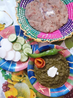 A picture of Sarson ka saag with bajry ki roti.