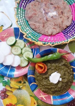 A picture of Sarson ka saag with bajry ki roti.