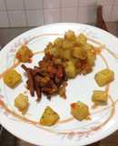 Chuleta de cerdo al agri dulce y papas con vegetales salteadas a la especia