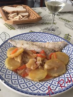 Una foto de Merluza al horno con patatas