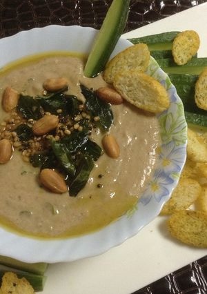 A picture of Mediterranean Hummus with Indian Tadka.