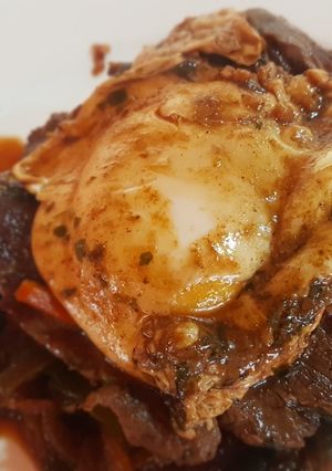 Una foto de Bife a la criolla