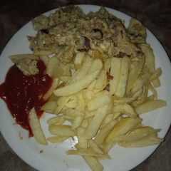 A picture of Chips,fried egg and kechop.