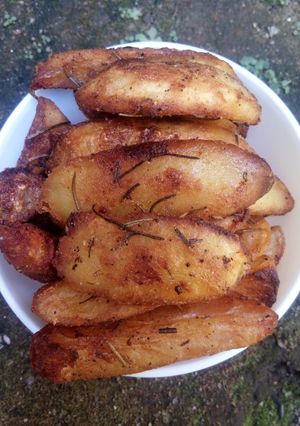 A picture of Rosemary potato wedges.