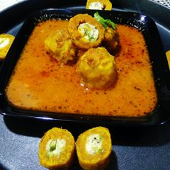 A picture of Paneer Stuffed Shahi Gatta Curry.