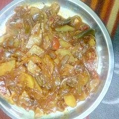 A picture of Onion potato tomato veg.
