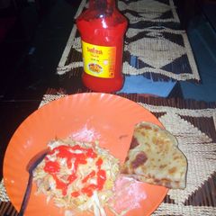 A picture of Homemade Chapatti served with steamed cabbage and sauce.