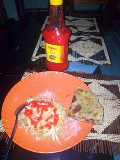 A picture of Homemade Chapatti served with steamed cabbage and sauce.