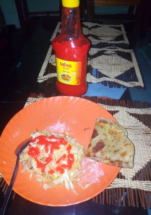 A picture of Homemade Chapatti served with steamed cabbage and sauce.
