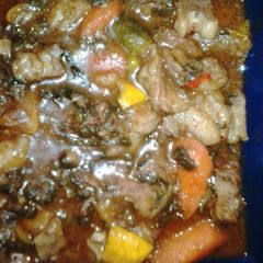 A picture of Lamb stew with spinach & mixed veg.