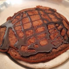 A picture of Eggless PanCake with Chocolate syrup.