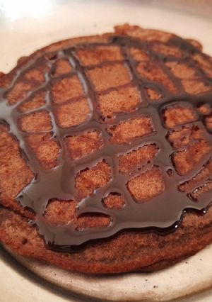 A picture of Eggless PanCake with Chocolate syrup.