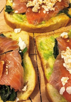 A picture of Avo toast with spinach, feta and salmon.