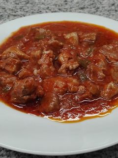 Una foto de Magro de cerdo con tomate