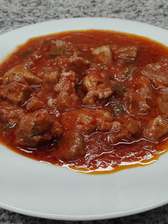 Una foto de Magro de cerdo con tomate