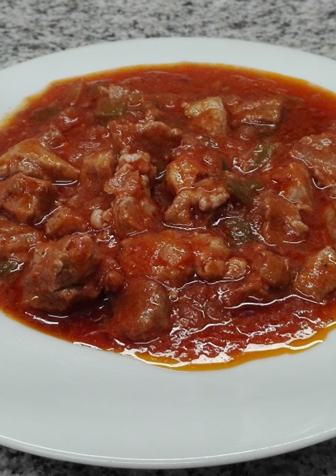 Una foto de Magro de cerdo con tomate