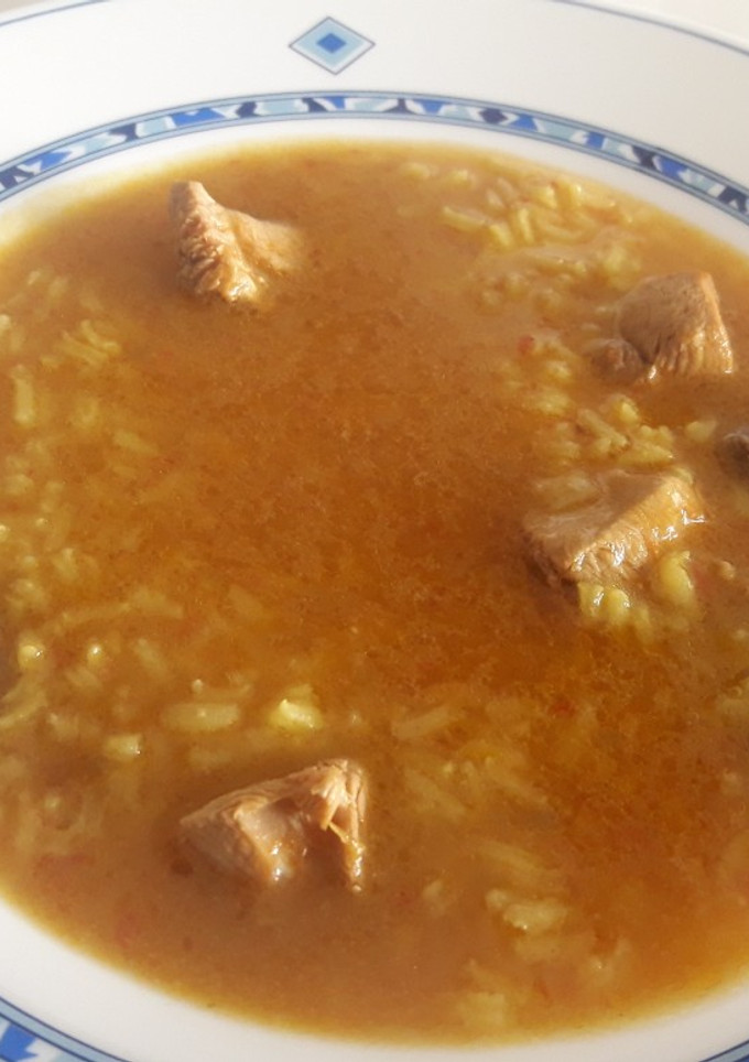 Una foto de Arroz caldoso con pollo