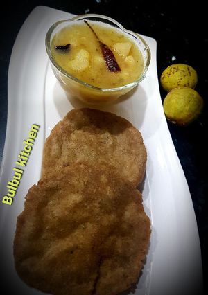 A picture of Singhara puri with khatte sabzi.