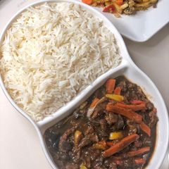 A picture of Basmati rice and beef sauce.