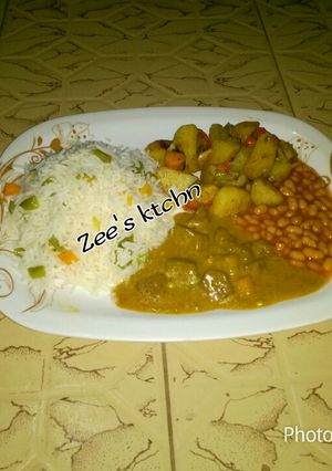 A picture of Basmati rice,baked potato, chicken curry soup wit baked beans.