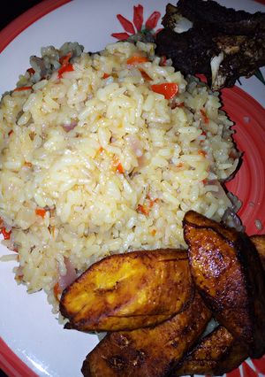 A picture of Local rice jollof and fried plantain with fried beef.