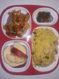 A picture of Curry Rice with little veggies.