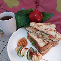 A picture of Toasted bread with fried potatoes n egg stick.