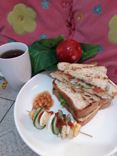 A picture of Toasted bread with fried potatoes n egg stick.