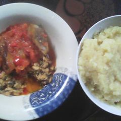A picture of EBA and Egusi with fish and ponmo.