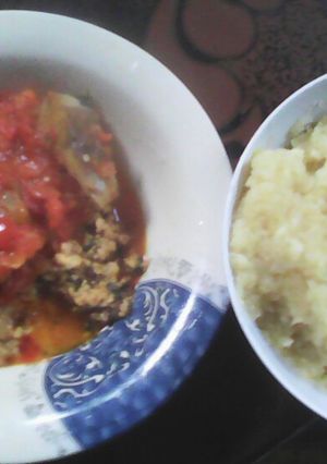 A picture of EBA and Egusi with fish and ponmo.