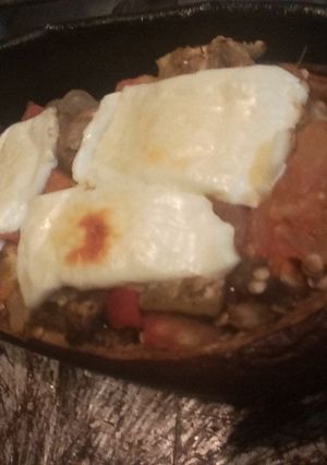Una foto de Berenjenas rellenas de verduras