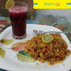 Tomato and Onion Poha with Energy booster Beetroot Tomato Ginger juice A picture of Tomato and Onion Poha with Energy booster Beetroot Tomato Ginger juice.