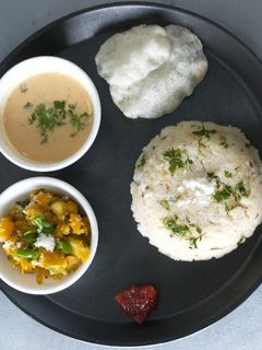 A picture of Upwas platter / Barnyard millet, peanut curry and Pumpkin curry.