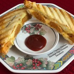 A picture of Grilled Cheesy Chicken Sausage Egg Omelette Sandwich.